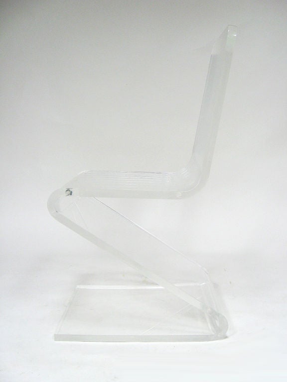 This classic lucite Z chair is a great occasional piece in very good original condition. The transparent quality and minimal form allow it to work in almost any interior.