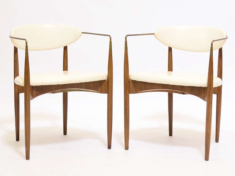 Often incorrectly attributed to Danish designer Ib Kofod-Larsen, these elegant chairs are an early design by American architect Dan Johnson. They were produced and distributed by Selig in the US. Like his famous Gazelle chair, this design is light,