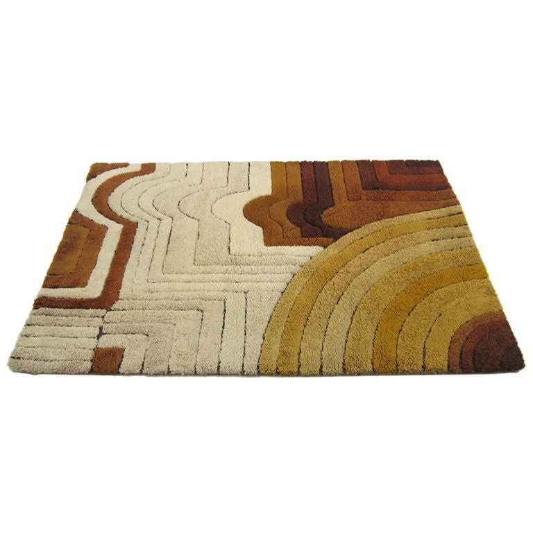 This high quality rich, deep-pile rug from Germany has a great graphic quality that reminds us of Frank Stella's paintings, but with a muted palette of ivory, tans and browns.