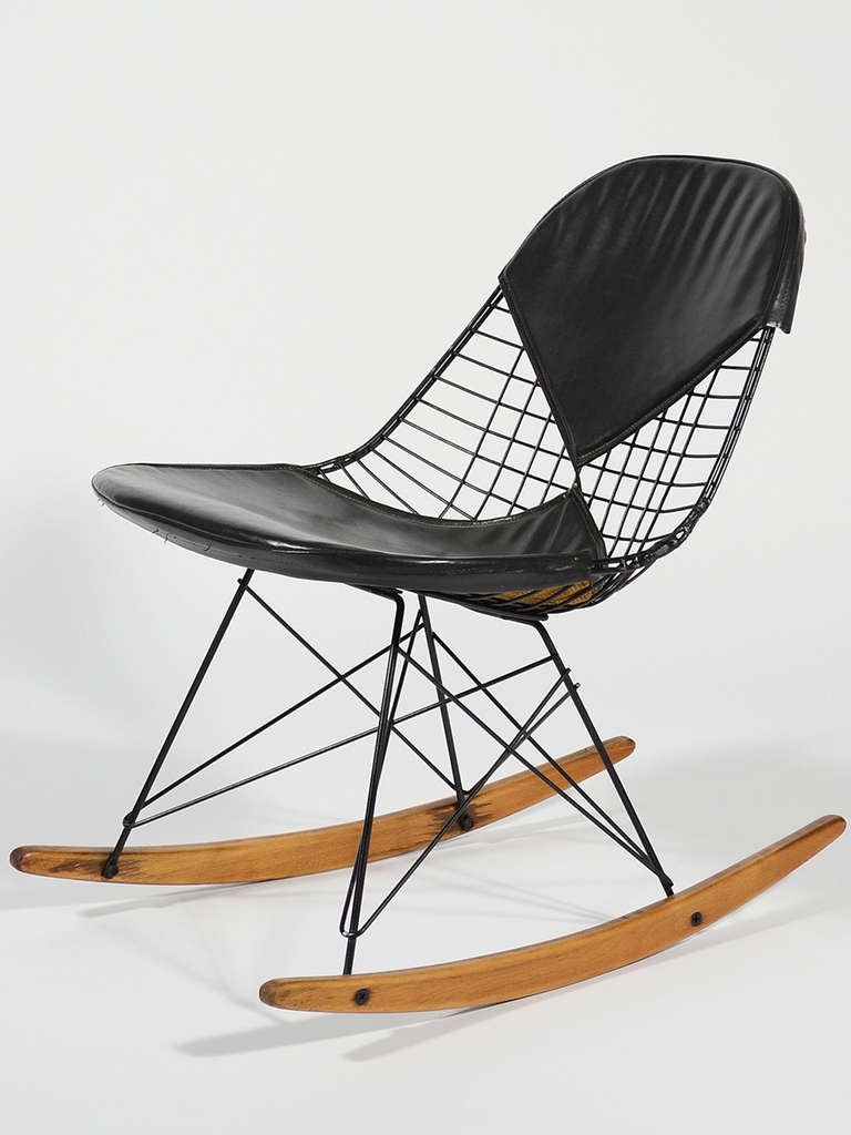 Charles and Ray Eames designed their fiberglass and wire chairs to be fitted with a wide variety of bases to offer a range of heights, uses, and aesthetics. One of the most desirable today is the rocker. This rare early example of the RKR dates from