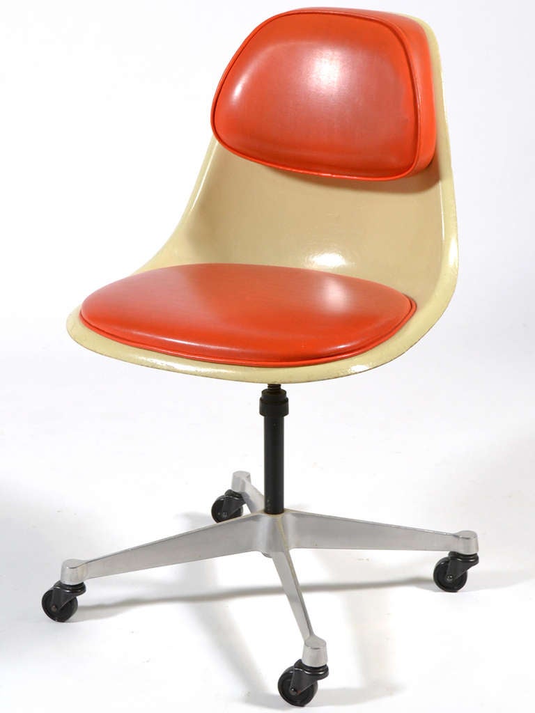 This model PSCC-4 chair is a rare variation of the fiberglass sideshell chair. It features a padded seat and back support which was designed to promote correct posture while working at a desk. The four star base has adjustable height and casters for