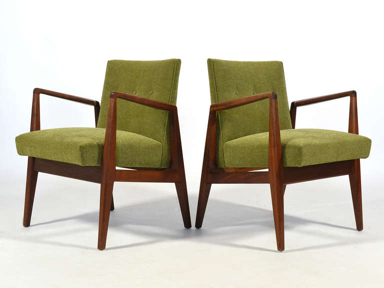 This beautiful pair of model 1103 armchairs are great examples of Jens Risom's blend of Scandinavian and American sensibilities. Similar to Finn Juhl's designs, the strong, angular wood frames cradle the upholstered seats and have several nice