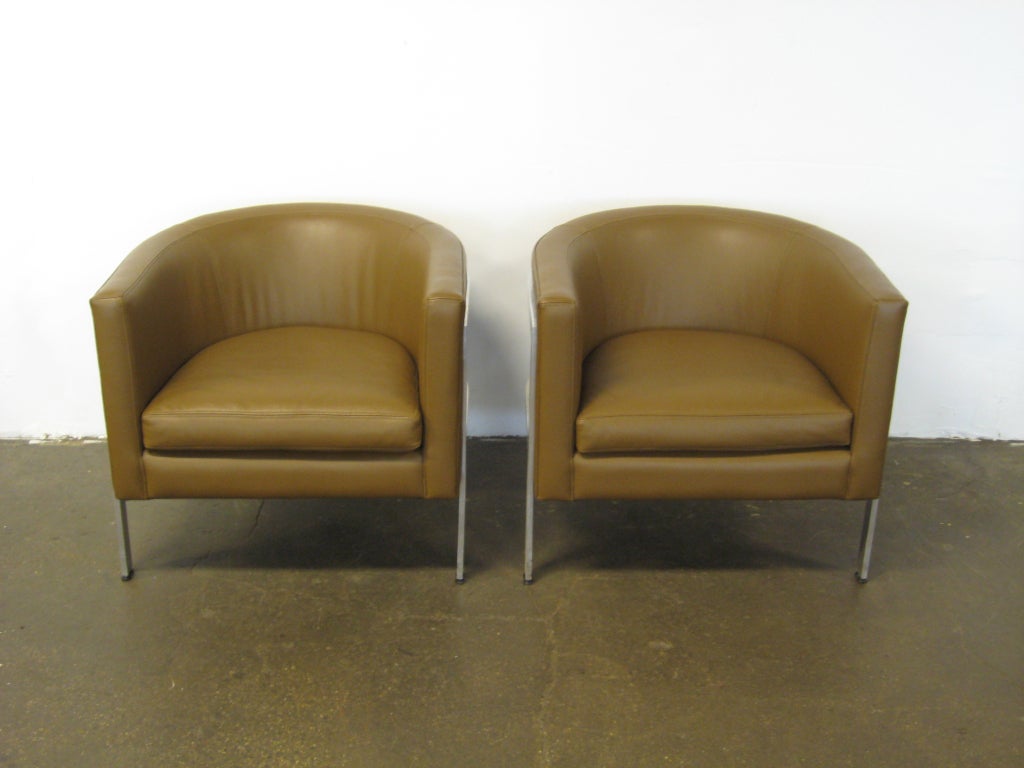 Pair of three-legged barrel back lounge chairs by Erwin-Lambeth 1