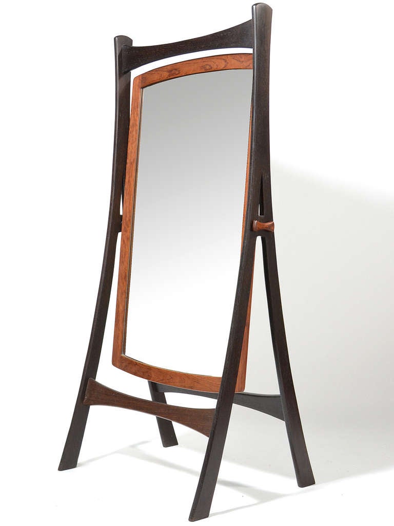 This stunning sculptural full size cheval mirror has a beautiful frame expertly constructed of wenge and teak. We have been unable to document the designer, but it is very similar in aesthetic to the work of Jens Quistgaard.