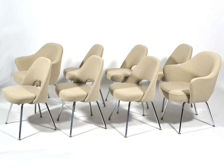 This set of Saarinen chairs is comprised of six side chairs and two arm chairs, all with chrome legs and upholstered in Knoll boucle in the neutral colorway. Handsome, timeless and very comfortable, they perfectly compliment a wide range of table