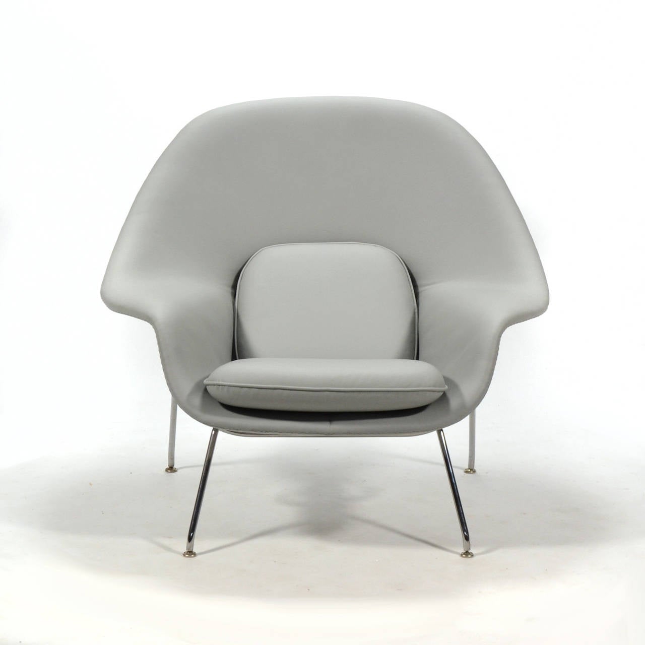 leather womb chair and ottoman