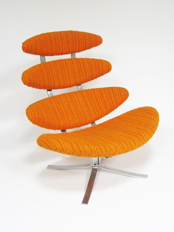 This spectacular example of an iconic design by  Poul Volther is in very good condition, still upholstered in the original textured orange wool stripe. A supremely comfortable chair, the segmented seat and back take their inspiration from the phases