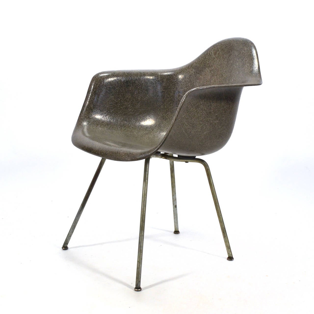 The earliest fiberglass Eames chairs were produced by Zenith Plastics and came in a limited palate including elephant hide gray. The Zenith produced shells are distinctive for their high fiber content and larger, more substantial rubber shock