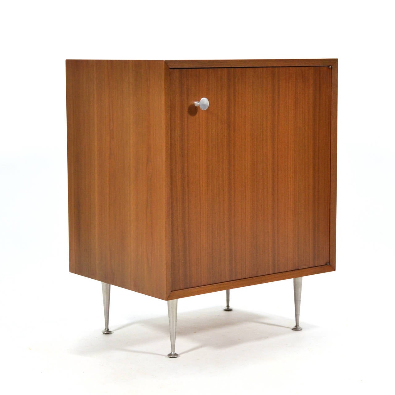 This handsome little cabinet has a terrific scale, making it the perfect occasional piece. Herman Miller offered a variety of legs and pulls for the case goods designed by Nelson. This model 4702 cabinet is from the basic cabinet series, but it has