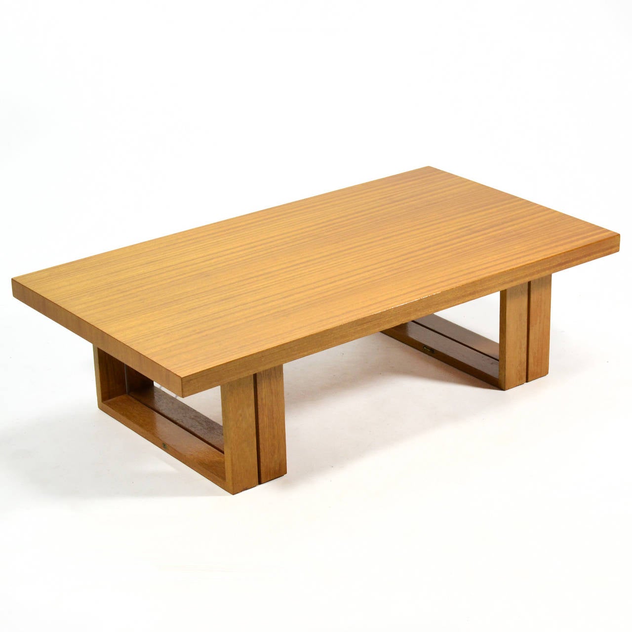 This beautiful and highly functional table designed by Hendrik Van Keppel and Taylor Green can convert from a coffee table to a dining table, work table or desk. The ingenious design features legs which are hinged to fold down and double up when a