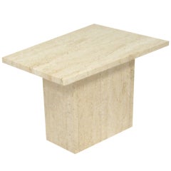 Small travertine side table with trapezoidal top
