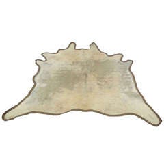 Used distressed ivory cow hide rug