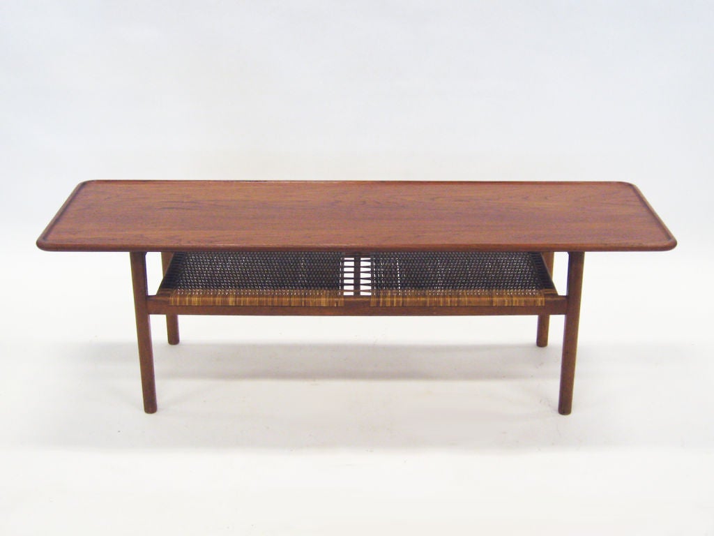 Hans Wegner’s designs always look fresh and inviting. This coffee table, model AT 10, has very refined detailing, yet the teak wood and woven cane lend a warmth that makes it look at home in nearly any interior. The height and proportions make this