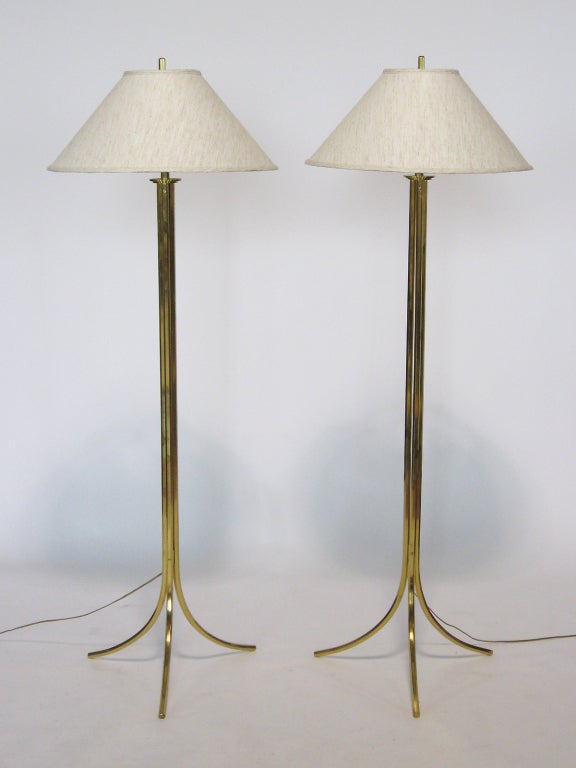 These elegant floor lamps by Lang-Levin are simply extraordinary. A masterful combination of refined design and exceptional craftsmanship. Made of solid brass in a hexagonal stock, the three sections that form the central column splay into legs at