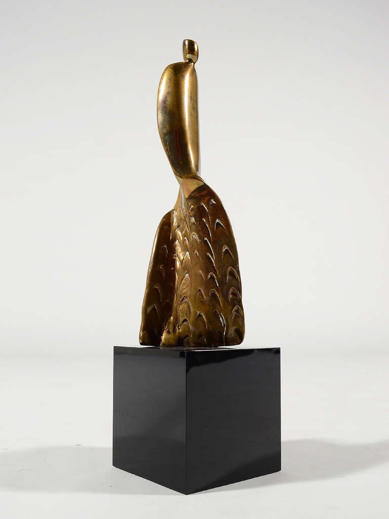 This delightful sculpture by Alfredo Burlini is cast of brass and mounted on a black lucite base. Titled 