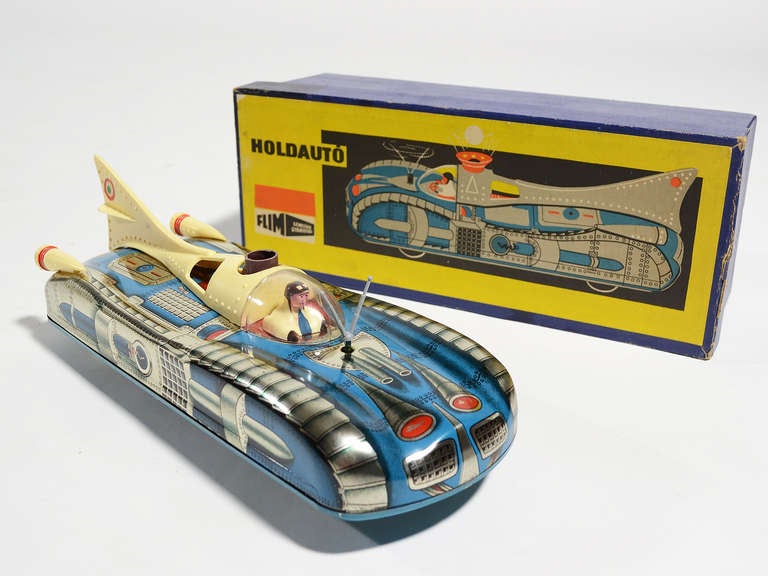 Hungarian manufacturer Holdauto made this terrific tin space car in 1967. It was discovered in near mint condition in  its original box.

The car measures 4.5