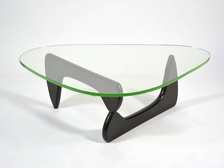 This exceptional Noguchi coffee table is the finest we have had in many years of collecting and dealing. Arguably the most beautiful modern coffee table ever designed, Noguchi turned a two-part sculpture in his distinctive style into a base that