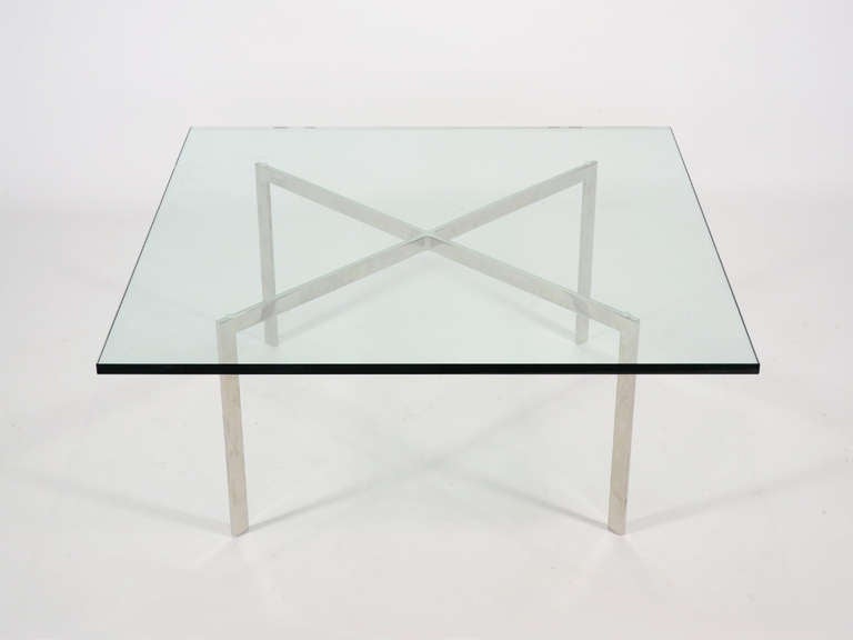 Originally designed for the Villa Tugendhat in Brno, this table by Ludwig Mies van der Rohe is a sublime example of minimalist modern design. With an X shaped base of stainless steel and a 40
