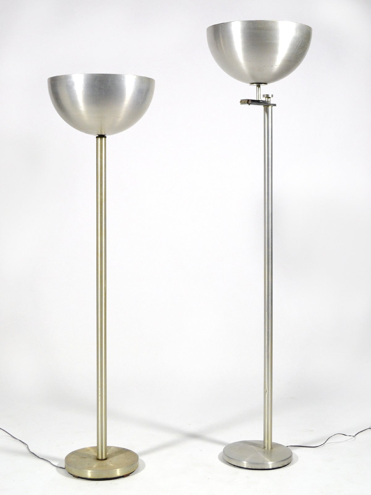 These two floor lamps by Kurt Versen are both handsome and highly functional. One is a simple up-light or torchiere, offering the most flattering ambient light. The other, a signature flip-top light, offers either the general room light of a