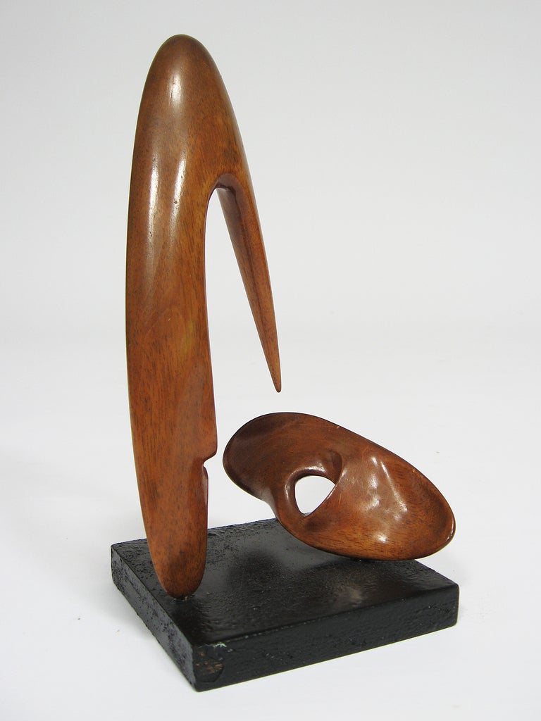 This wonderful abstract wood sculpture from the 1950s is a powerful piece despite its diminutive size. The piece reminds us of Isamu Noguchi, Leo Amino and others working with biomorphic abstraction in the period. 

The piece is signed by the