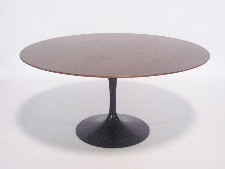 A spectacular example of an icon of modern design, this early production Saarinen tulip table has an uncommon black base and large 60