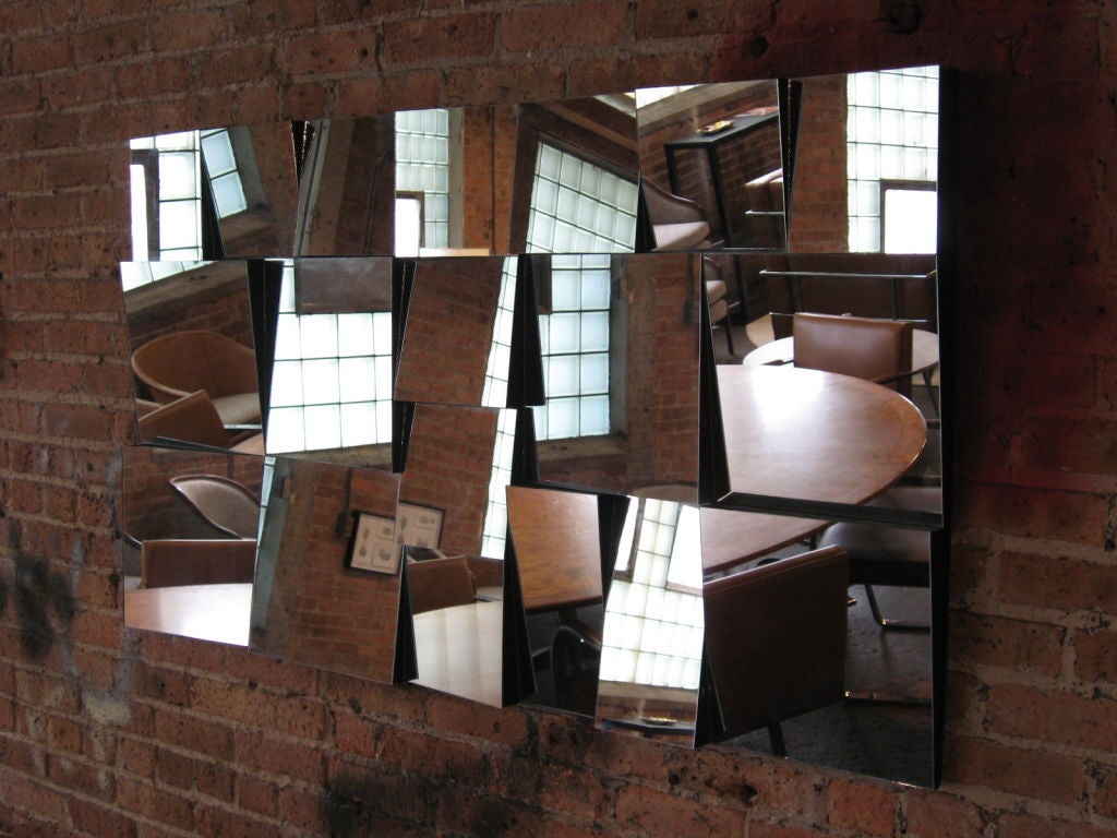Vintage Neal Small “Slopes” faceted wall mirror