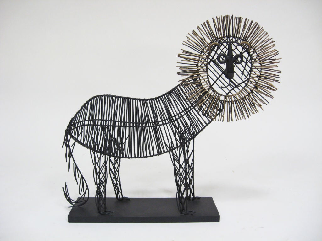 A wonderful, whimsical lion sculpture made of bent and welded wire; this piece has a playful, graphic quality that reminds us of Alexander Girard or some of the folk art that inspired his work. While unsigned, we’ve had this design before signed by