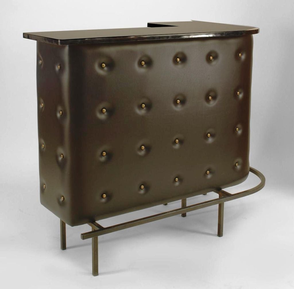 Bar/cabinet with capitonne black synthetic leather with bronze buttons and black lacquered top.