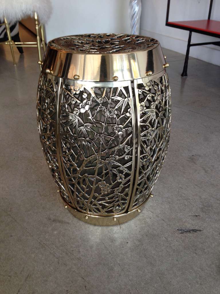 A heavy brass fretwork garden stool. See our other listing with it's nearly identical twin. Half inch difference in measurements.
