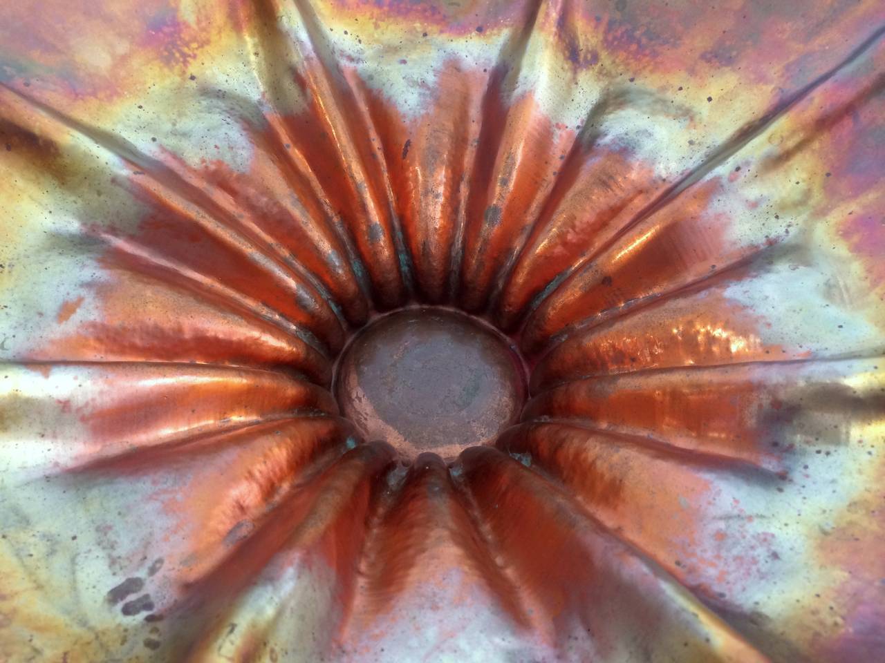 Copper formed into a slightly fluted bowl with dramatic heat-oxidized coloration. Signed and numbered on bottom. Pre-2000.