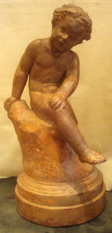 Terracotta finished stone composite sculpture of a young male nymph resting on a rock.

Mounted on a round step molded base,

French, mid-19th century.