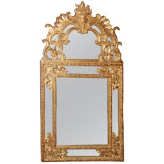 Miroir en bois doré de style Régence