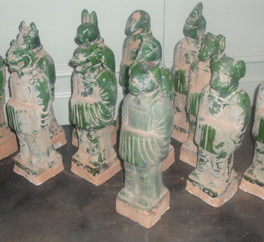 Very Charming Chinese Export, Partially Glazed Spinach Green Chinese Zodiac Figurines, Each Terracotta Form Representative of the Animal Assigned by Birth Year to the Chinese Calendar, with Realistic Animal Heads on Standing Human Forms in Robes,