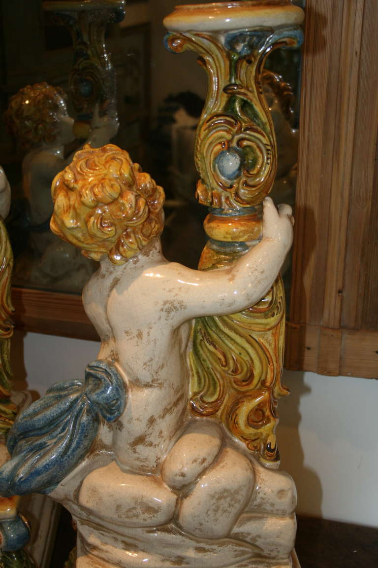 Painted Large Pair of Italian Majolica Putti Candleholders For Sale