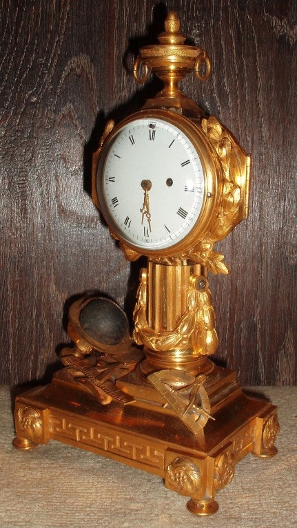 Very handsome moulded bronze dorè mantel clock, glass door covered dial with roman numerals and numbered quarter hour points, reverse door with interior pierced cover plate and signed mechanism; 