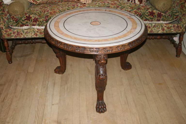 Oak monopodia lion tripod table with marble top.