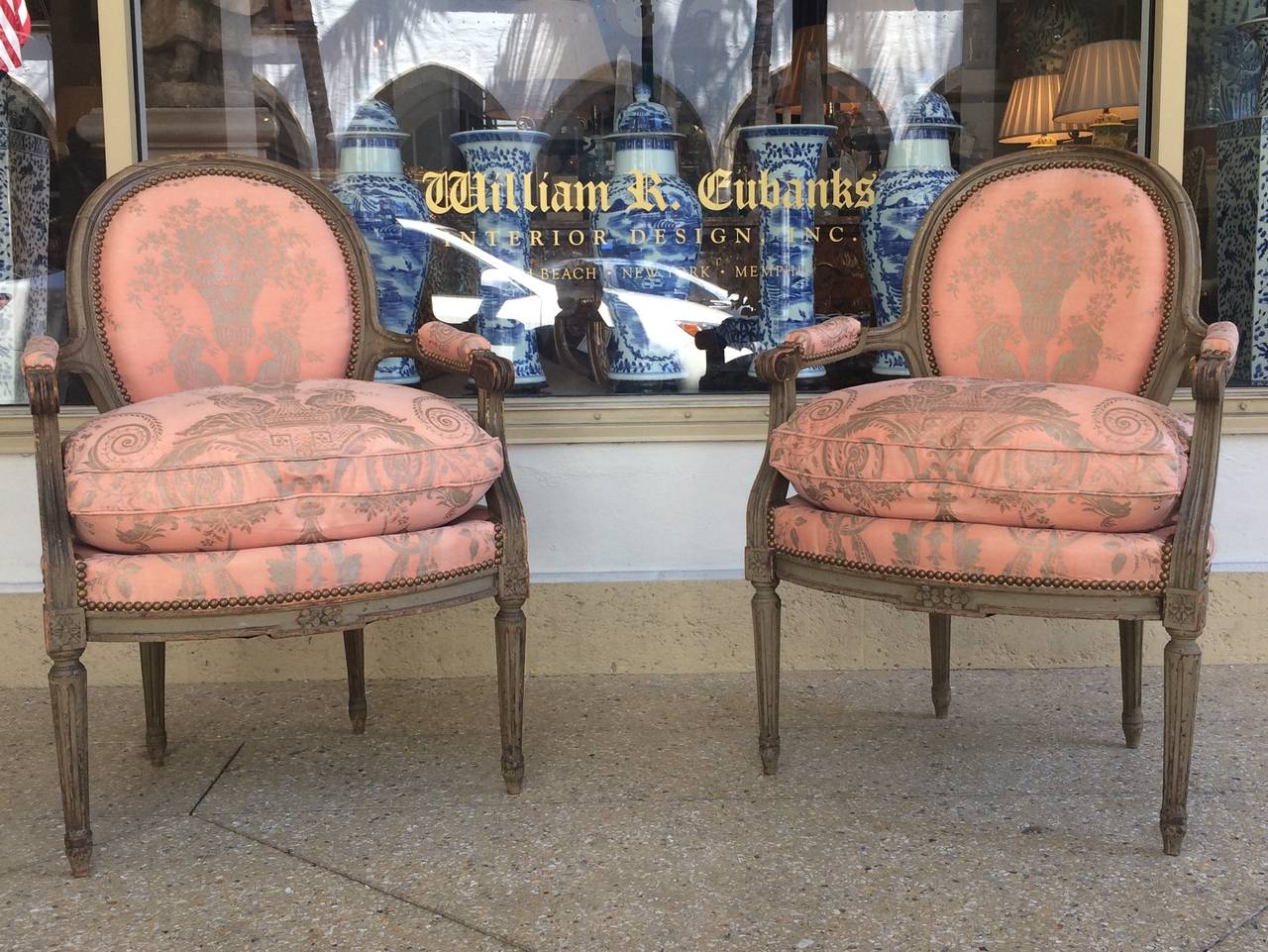 Beautiful pair of Louis XVI Grey-painted Fauteuils, upholstered in Apricot Fortuny fabric with loose seat cushion. Late 18th century.
