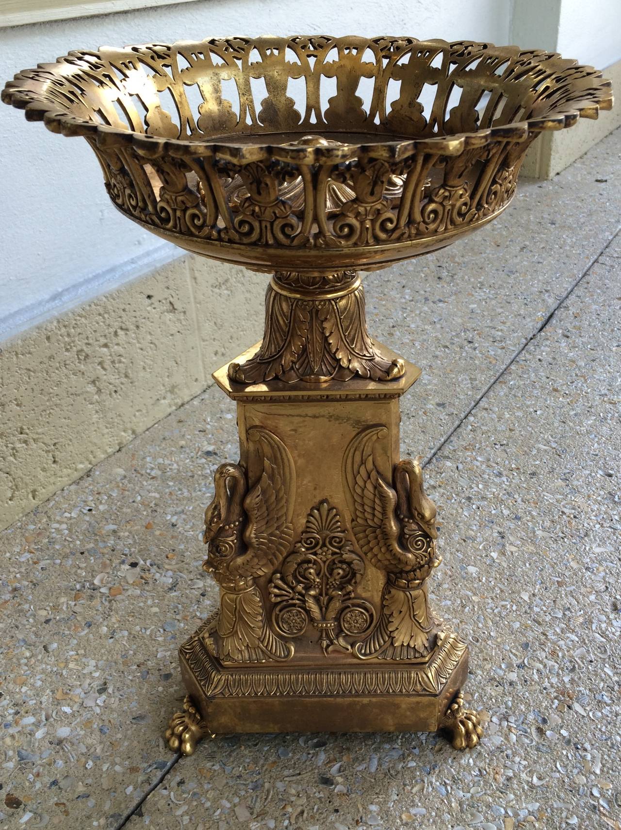 Charles X bronze doré centerpiece with decorative mounts including swans, acanthus leaf, and claw footed base, circa 1820-1830.