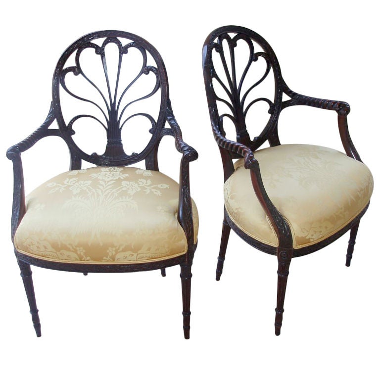 Handsome Pair of 19th Century, George III Style Gold Silk Upholstered Mahogany Arm Chairs, Eight Detailed Plumes within the Oval Back Joined at the Mid Section with Carved Arms of a Folded Leaf Design Terminating in Rosettes, Banded with an