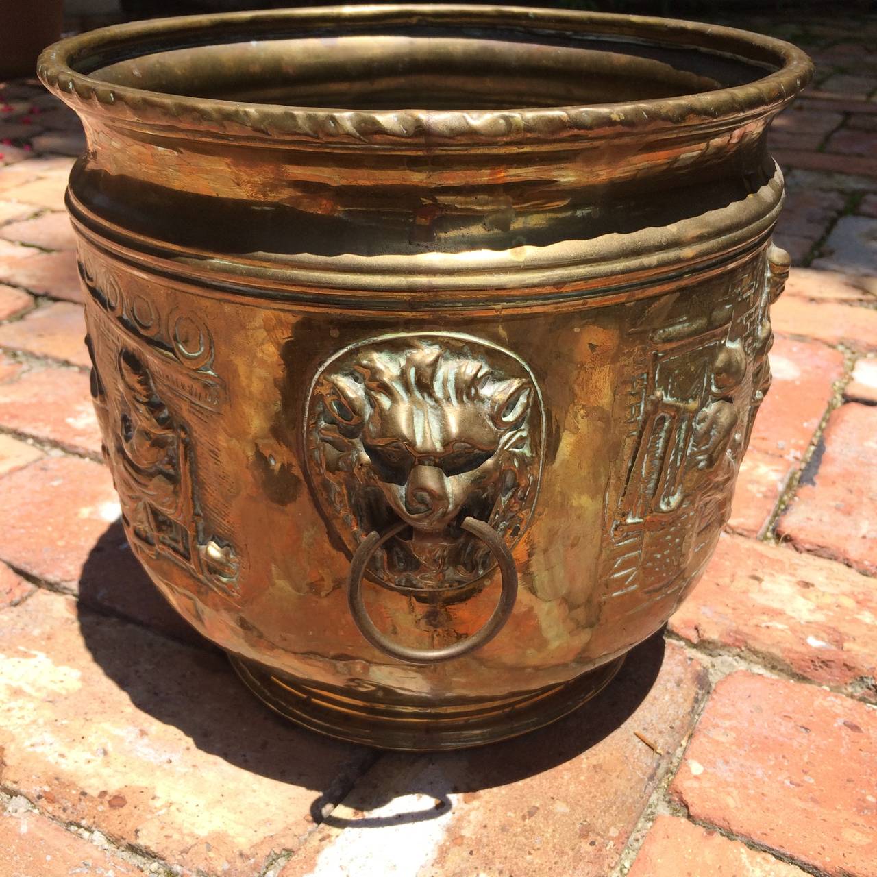 Fine 19th century brass planter from the H.W. Keil collection, Broadway, England, well detailed hammered figural designs and side mounted lion mask handles.