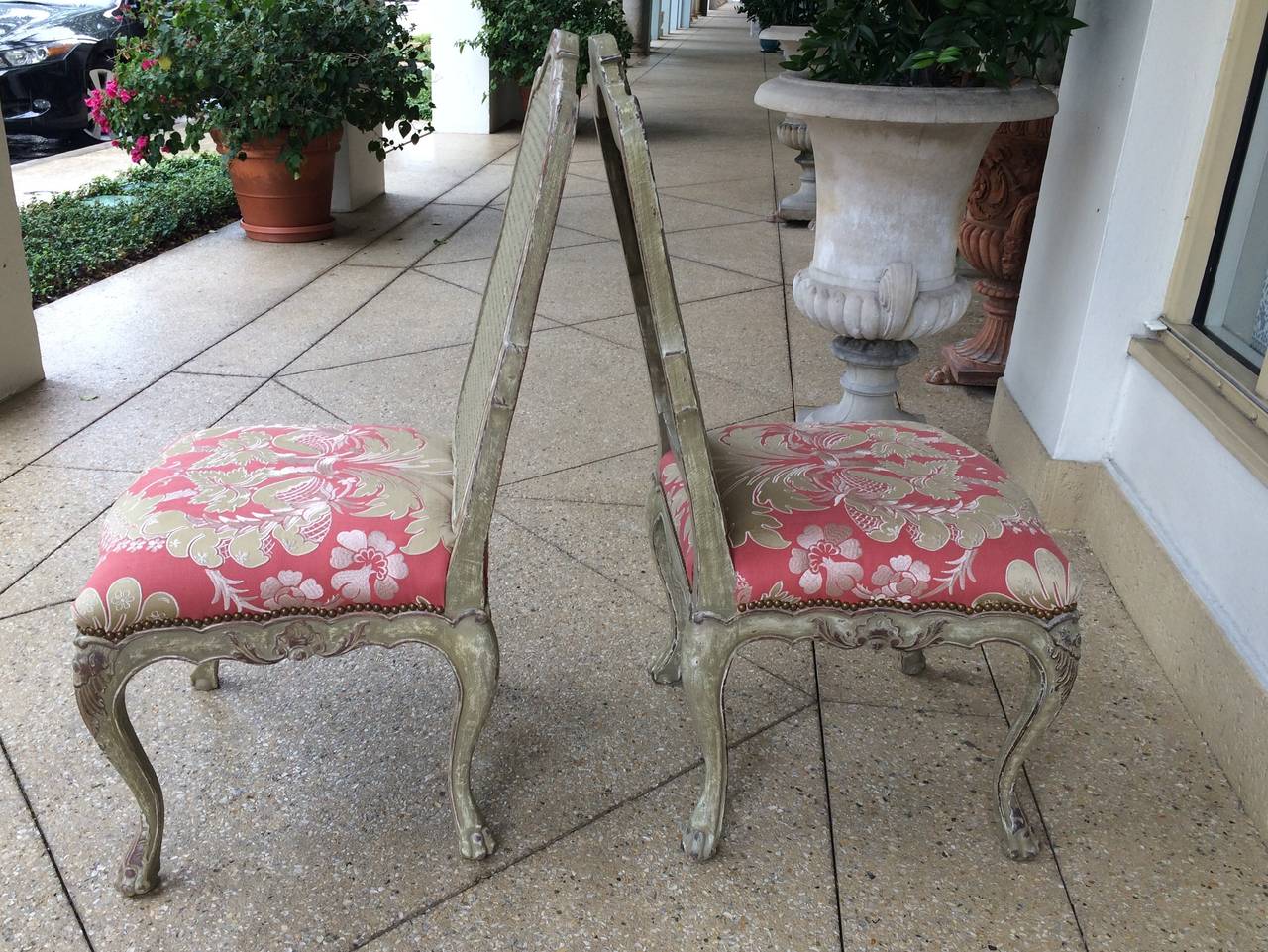 Pair of 18th century style Italian side chairs, carved wood with cane back, distressed green/grey antique finish