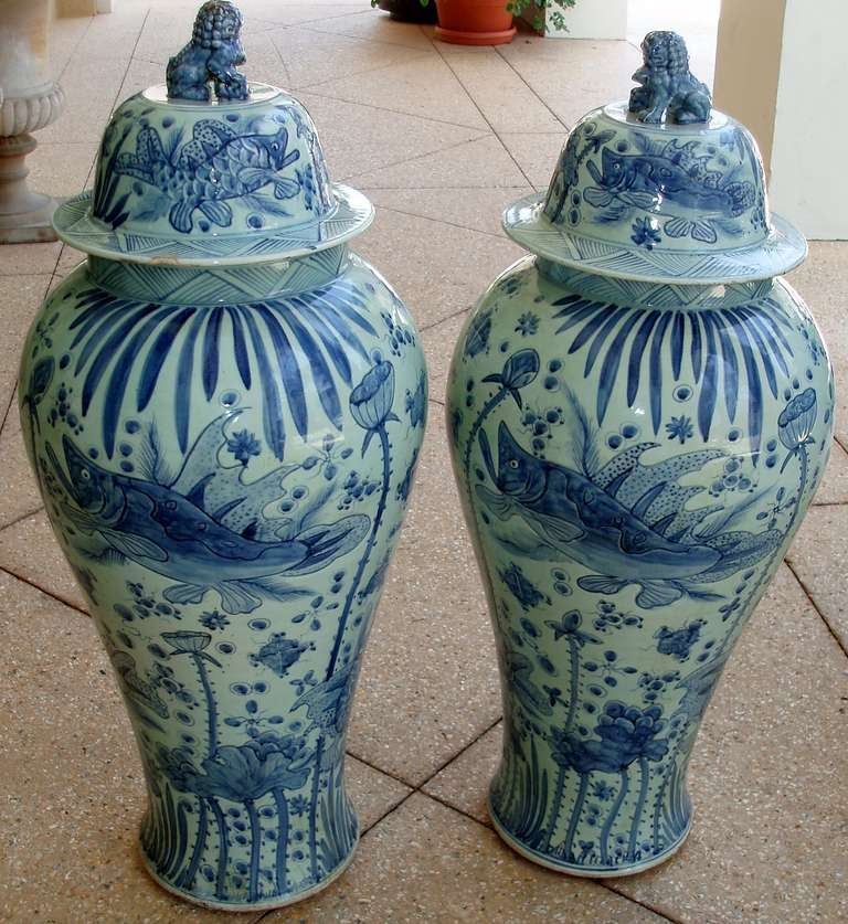 Hand-Painted Pair of Tall Blue and White Chinese Porcelain Lidded Jars