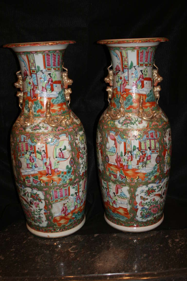 Very charming pair of large 19th century Chinese export porcelain Famille rose baluster vases, multi-panel motif decorated with palace figures within courtyard and pavilion settings, with floral and bird designs, all surrounded by a profusion of
