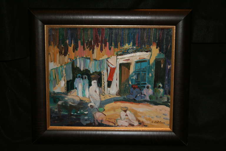 Peinture moderne à l'huile sur toile très colorée représentant une scène de village nord-africain (dans un cadre marron foncé à finition lisse).
Isabelle Del-Piano, française, 1955