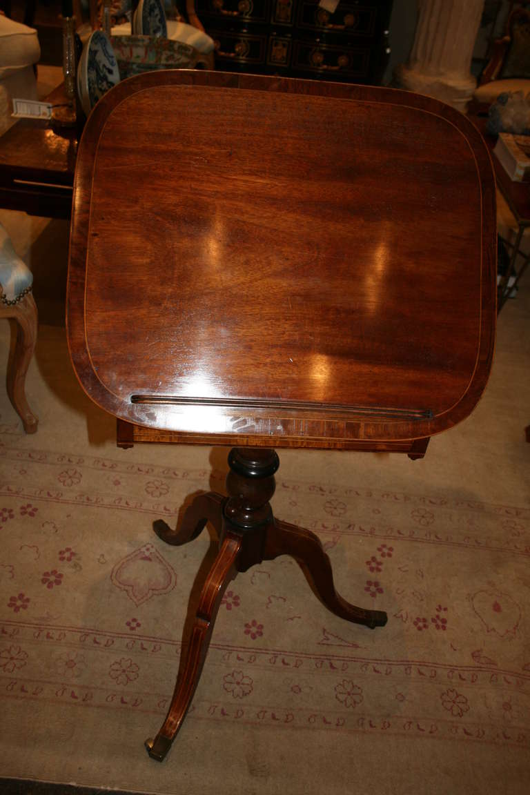 Fine George III mahogany Sheraton reading table with adjustable stem and
drawer, circa 1795.
