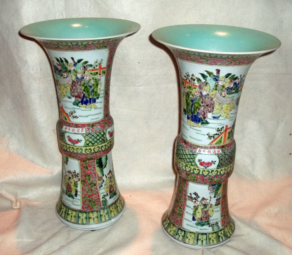 Pair of Large Trumpet Multi-Color Yen Yen Vases in the Famille Rose Style Decorated with Framed Panels of Figures in Landscape Settings Surrounded with Pink and Green Floral Designs