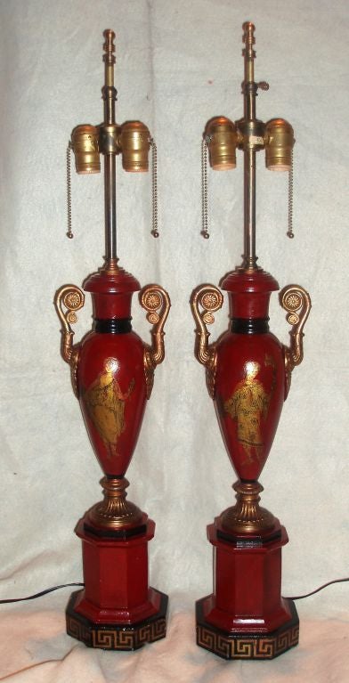 Very fine pair of Charles X period urn form red tole lamps with gold hand-painted and black detailed, male and female roman figures on hexagonal bases with Greek key trim.