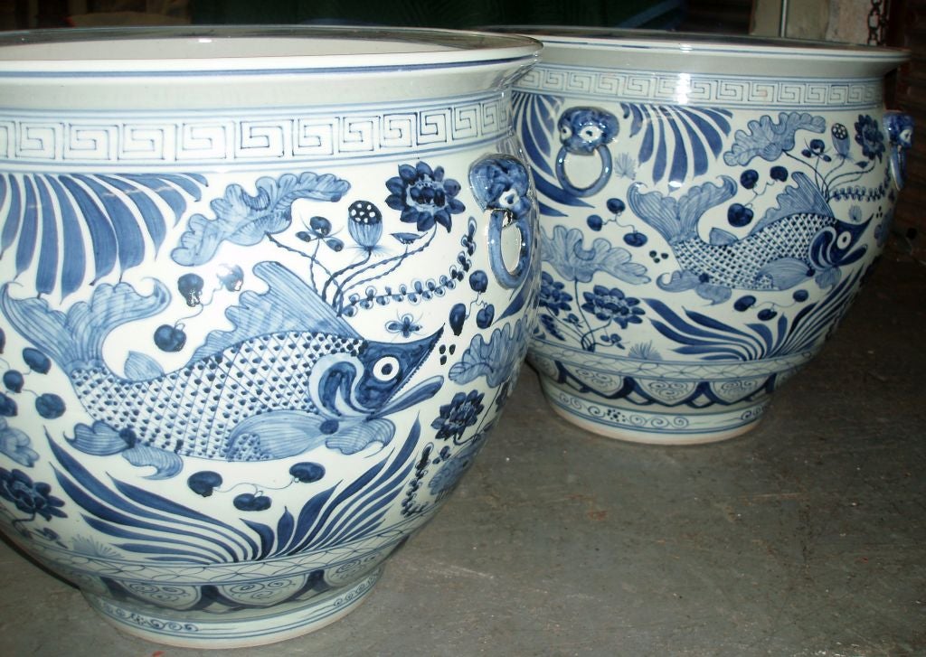 Marvelous Pair of Blue & White Chinese Export Fishbowls, Displaying Well Detailed Fish and Underwater Elements within a Greek Key Border at the Top, and a Decorative Floral Design at the Base, with Mounted Foo Dog Handles and Flat Detailed Rims