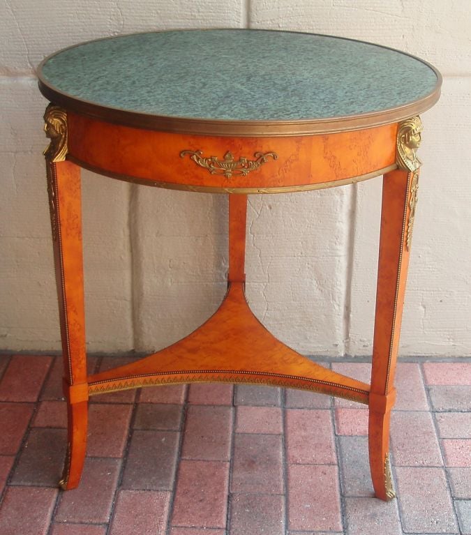 Fine Karelian wood tri-pod table with brass mounts in the Directoire taste with polished verdigris stone top.