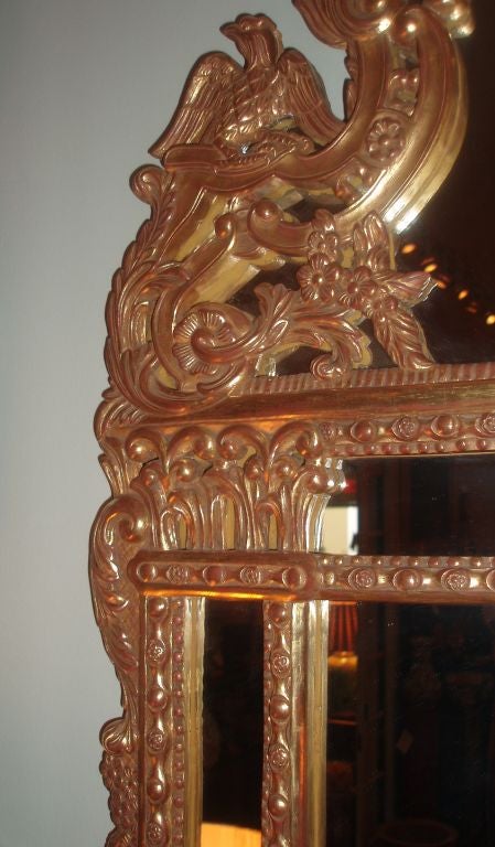 Carved Regence Style Giltwood Framed Mirror For Sale